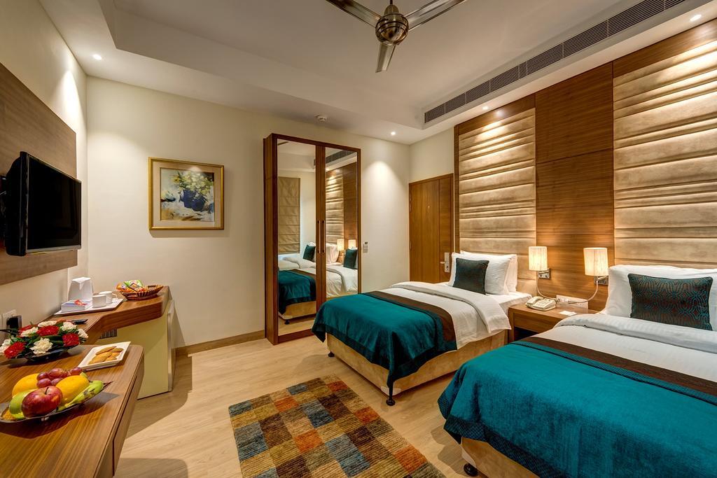 The Astor Hotell Kolkata Rom bilde