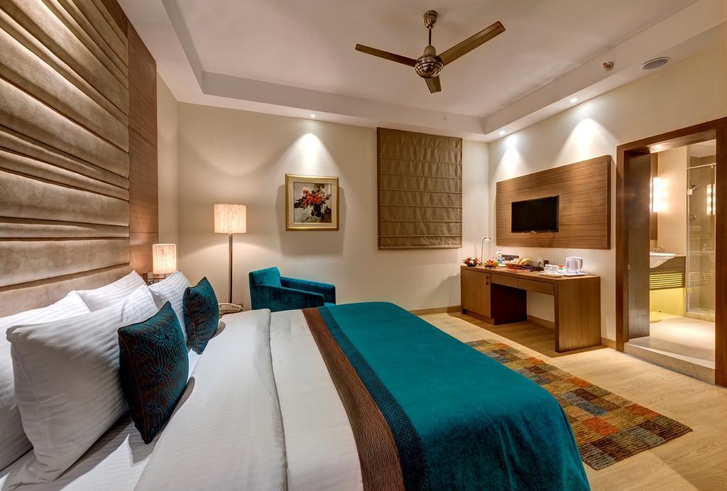 The Astor Hotell Kolkata Rom bilde